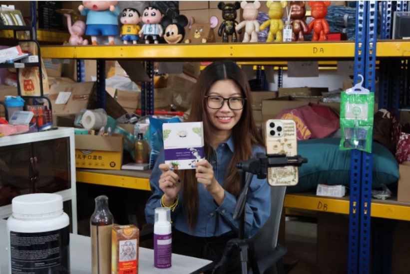 Joey doing live selling on her phone.