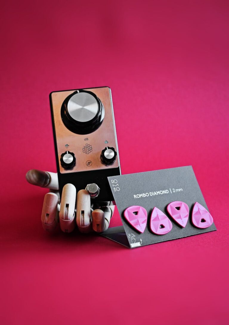 guitar picks with distortion pedal in artificial hand