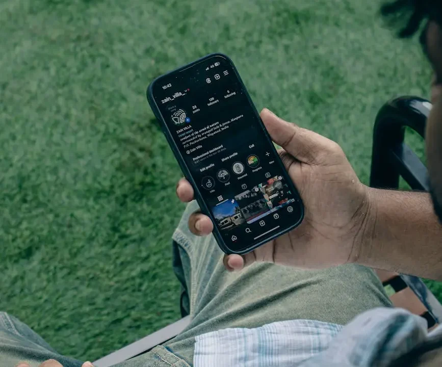 person browsing social media on smartphone outdoors