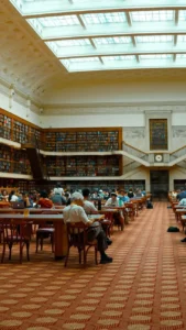 spacious public library with skylight and bookshelves